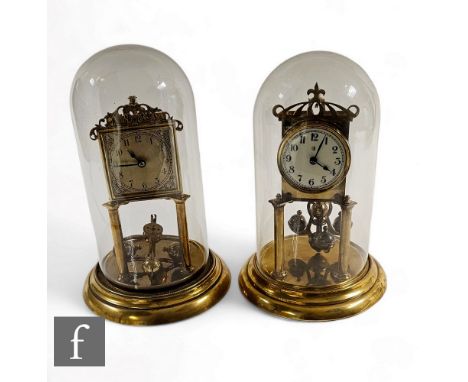 A early 20th Century brass 365 day mantle clock, Arabic circular dial, in glass dome on stepped circular base, and a similar 