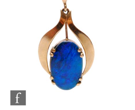 An opal doublet pendant on a 9ct mount, length 3cm, with suspension loop, stamped 9ct. 