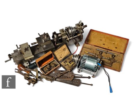A small engineer's lathe with motor length and accessories including a cased Jacot tool and watch makers tools, some cased. (