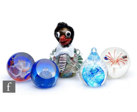 A 20th Century Murano glass paperweight, modelled as a clown, with a scramble cane sphere base and applied glass features, he