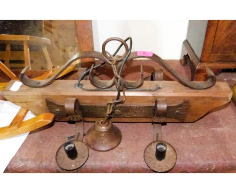 An oak and wrought iron hanging lamp