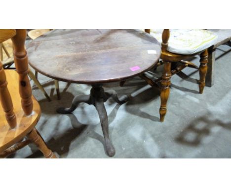 A 19th century mahogany drop leaf tripod table. 23½'' diameter