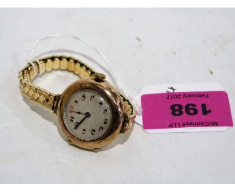 A Rolex 9ct lady's wristwatch, the Dennison case hallmarked for Birmingham 1917 and numbered incuse 108943, the engine turned