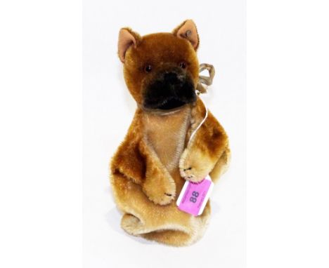 A Steiff gold plush dog glove puppet with glass eyes and button in ear. 9'' high