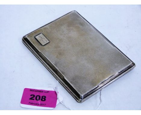 A George VI silver engine turned cigarette case with engraved cartouche. Chester 1937. 5ozs