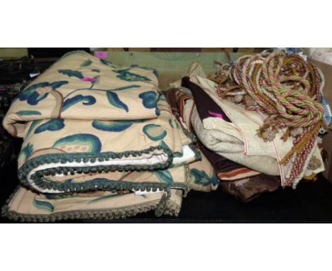 A pair of heavy curtains and some tapestry runners