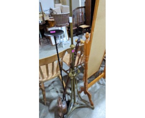 An Edwardian VII wrought brass lamp standard, copper warming pan and a candle stand