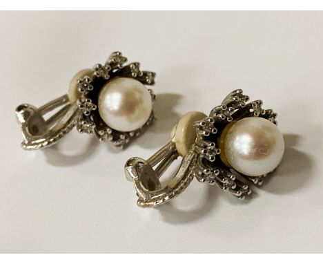 18CT WHITE GOLD EARRINGS (CLIP ON) WITH PEARL CENTRE SURROUNDED BY DIAMONDS