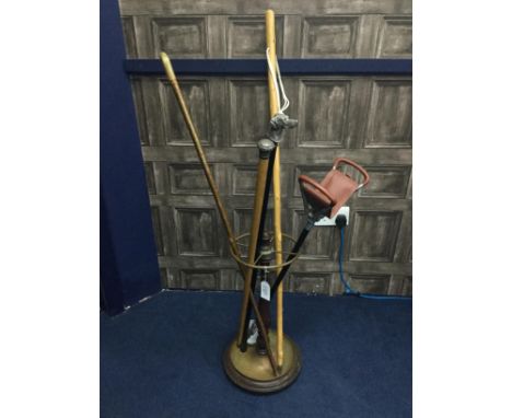 MAHOGANY UMBRELLA STAND, along with a collection of walking sticks including one with silver top and one with dog head motif 