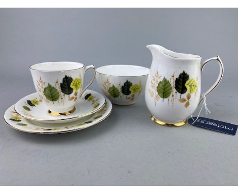 ELIZABETHAN PART TEA SERVICE, with floral and gilt decoration, along with Crown Ducal bowls and a blue and gilt serving dish