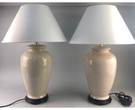 PAIR OF CERAMIC TABLE LAMPS, of large proportions, each mounted to circular stained wood base, approximately 70cm high overal