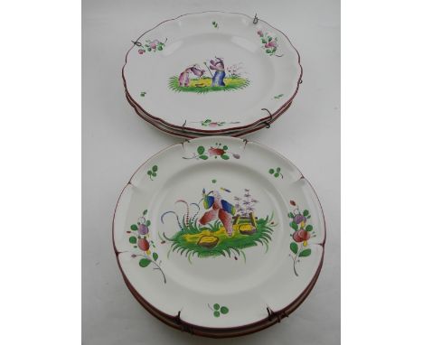 Four 18th century style Delftware display chargers, decorated in the chinoiserie taste, bears 'St Clement, France'.