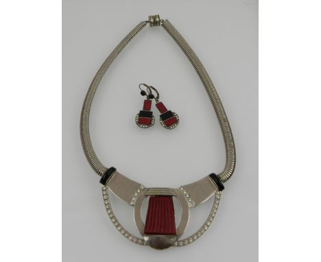 An Art Deco period silver, onyx, and red stone necklace, decorated with white paste stones, together with a pair of matching 