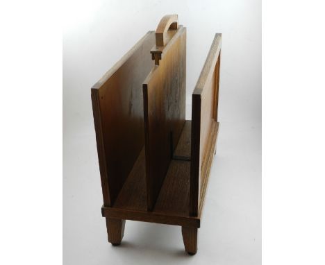An Art Deco oak magazine rack.
