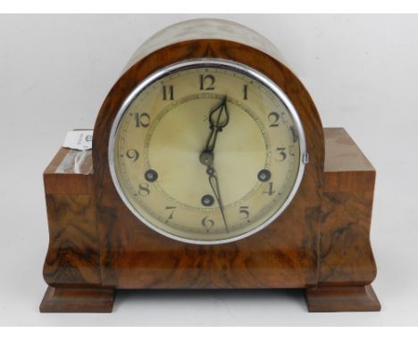 An early 20th century burr walnut cased mantle clock, having a quarter repeating movement. H: 21cm W: 27cm D: 12cm