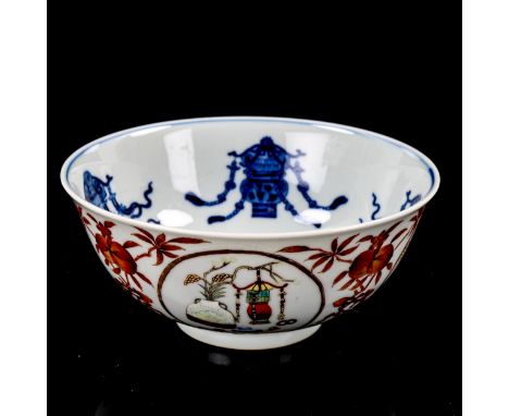 A Chinese porcelain bowl, with painted enamel panels, in iron red surround and blue painted interior, seal mark, diameter 15c