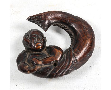 Japanese carved wood netsuke, in the form of a fish swallowing a man, Meiji Period, length 5.5cm 