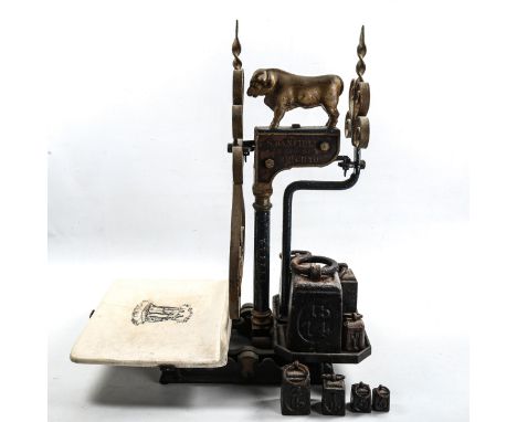Set of Victorian grocer's balance scales, with gilded cast-iron bull design finial, maker S Banfield of Brighton, with transf