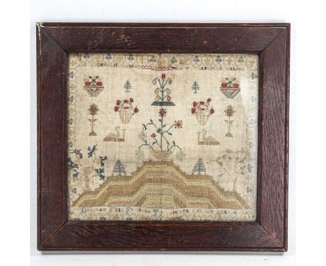 A 19th century needlework sampler, indistinct date, oak frame, overall 37cm x 41cm 