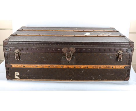 LOUIS VUITTON - vintage wood and leather-bound travelling trunk, LV monogram allover with metal carrying handles, tray-fitted