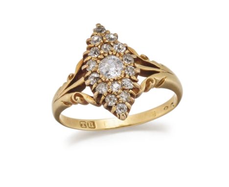A DIAMOND RING, the marquise shaped mount set with graduated stones between split scrolling shoulders. Ring size KThe absence