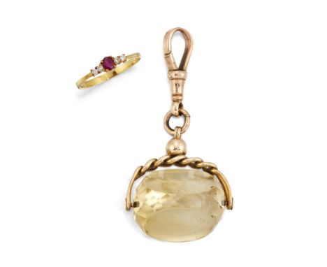 A 14 CARAT GOLD RUBY AND DIAMOND RING AND A CITRINE FOB, the small central ruby set to either side with a small round diamond