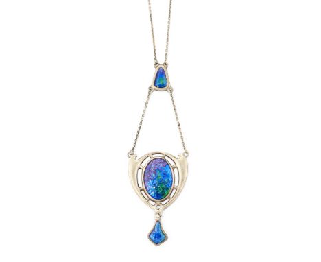A SILVER AND ENAMEL PENDANT BY CHARLES HORNER, the central oval blue-green-purple enamel disc, set to either side with stylis