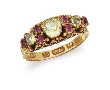 A 15 CARAT GOLD PERIDOT AND RUBY RING, the central off-oval peridot set to either side with two small rubies, an off-round pe