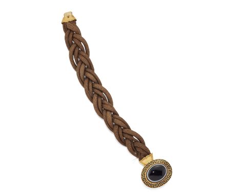 A MID VICTORIAN HAIRWORK MOURNING BRACELET, the four strand plaited brown hairwork strap, approx. 24mm wide, set with a bande