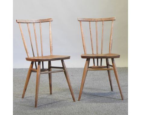 A pair of Ercol stick back dining chairs