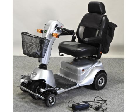 A silver AVC Quingo plus electric mobility scooter, with charger