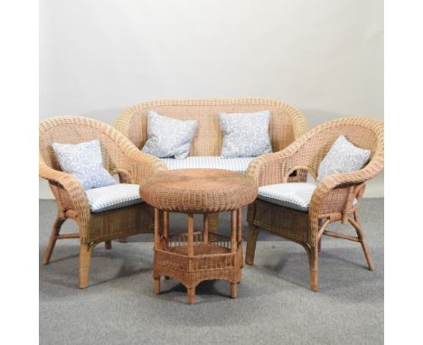 A wicker conservatory suite, comprising a sofa, 130cm, two armchairs and an occasional table