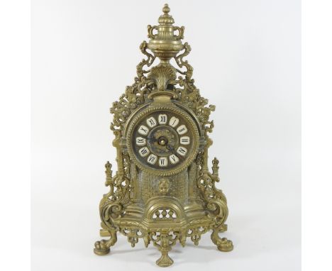An ornate brass mantel clock, 42cm high