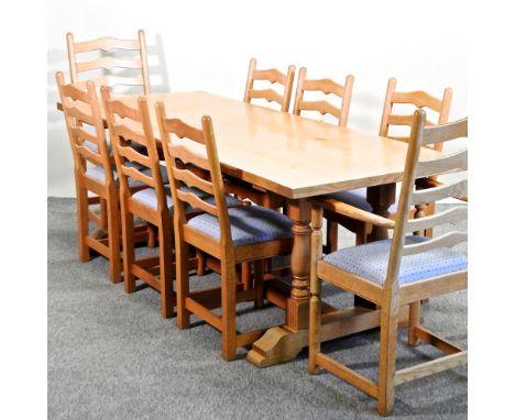 An 18th century style light oak refectory dining table, 216 x 86cm, together with a set of eight dining chairs, to include a 