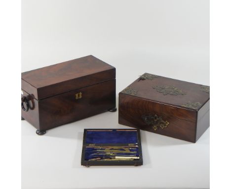 A George III mahogany tea caddy, 31cm, together with a Victorian brass mounted box and a 19th century drawing set, cased (3)