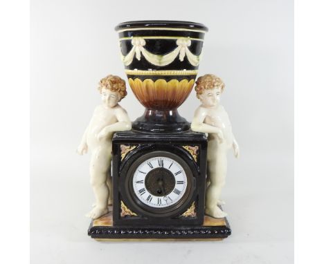 A Victorian style majolica mantel clock, 43cm high