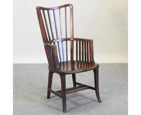 An early 20th century oak and elm stick back armchair, mounted with a plaque dated 1915