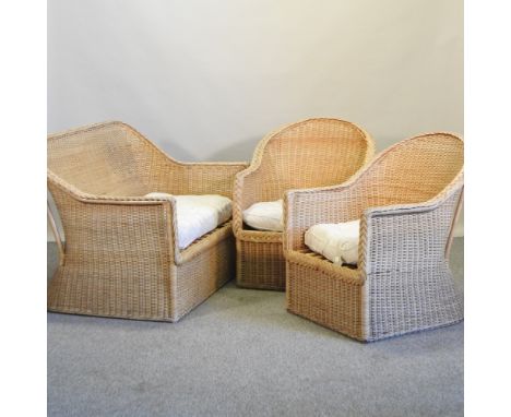 A wicker conservatory suite, comprising a sofa, 120cm and a pair of armchairs