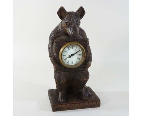 A black forest style mantel clock, in the form of a bear, 30cm high