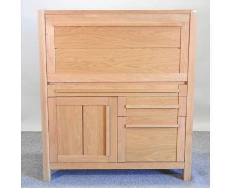 A modern light oak cabinet, with a hinged fall and doors below, 114cm