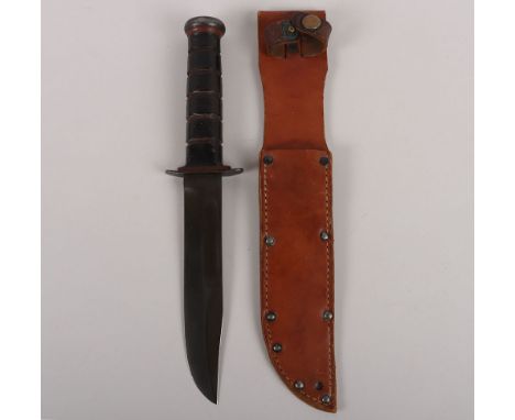 WW2 USMC Mk2 Fighting Knife by PAL, housed in the original leather scabbard. Blade measures 17 ½ cms, overall 33cms. 