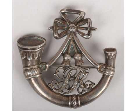 ‘SR’ Hat Badge. Fine quality badge in die-stamped silver coloured metal, ornate strung bugle horn with script ‘SR’ within the