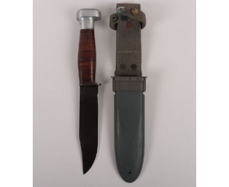 WW2 USN Mk1 Fighting Knife by Geneva Force Inc, housed in original scabbard. Blade measures 13cms, overall 27cms. 