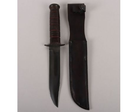 WW2 USMC KA-BAR Fighting Knife by Olean NY, housed in the original leather scabbard. Blade measures 18cms, overall 33cms. 