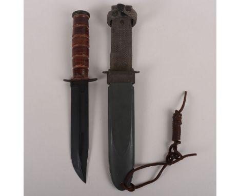 WW2 USN Mk2 Fighting Knife by Camillus NY, original parkerised finished blade, housed in original scabbard. Good condition ov