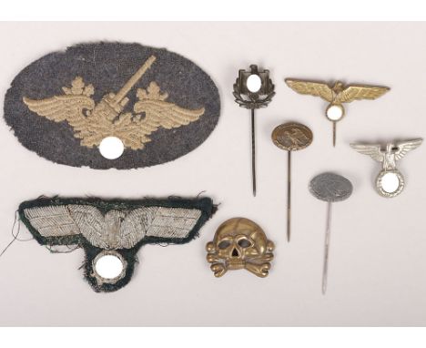 Small Group of Third Reich Stickpins and Insignia, lot includes a Luftwaffe flak proficiency patch, two DLRG stickpins, two c