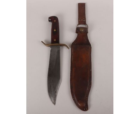 American Vietnam War Era W49 Western US Bowie Knife, housed in its original brown leather scabbard. Maker marked to the forte