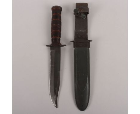 WW2 USN Mk2 Fighting Knife, Blade by US UTICA CUT CO, slight sharpening to the edge. Housed in original scabbard. Blade 18cms