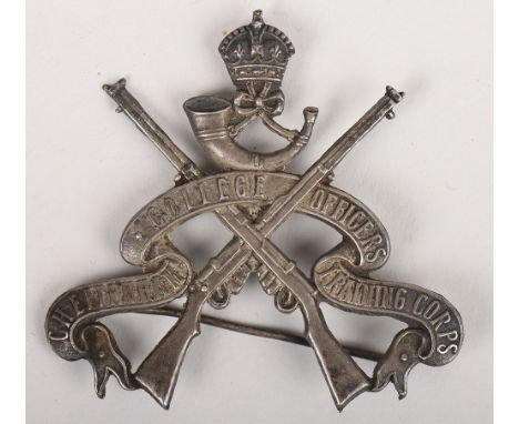 Cheltenham College Officers Training Corps, an ornate die-stamped silver coloured metal arm badge (?), featuring the full tit