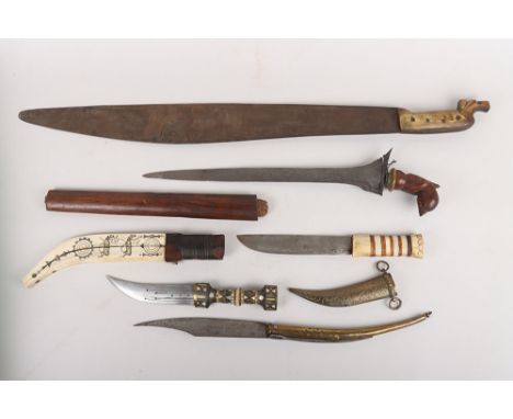Assorted Knives & Daggers, including a Lappish reindeer herders knife in its bone scabbard with etched scenes; Kris in damage